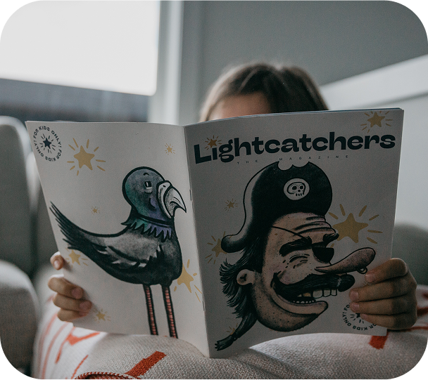 A little girl enjoying the Lightcatchers kid magazine