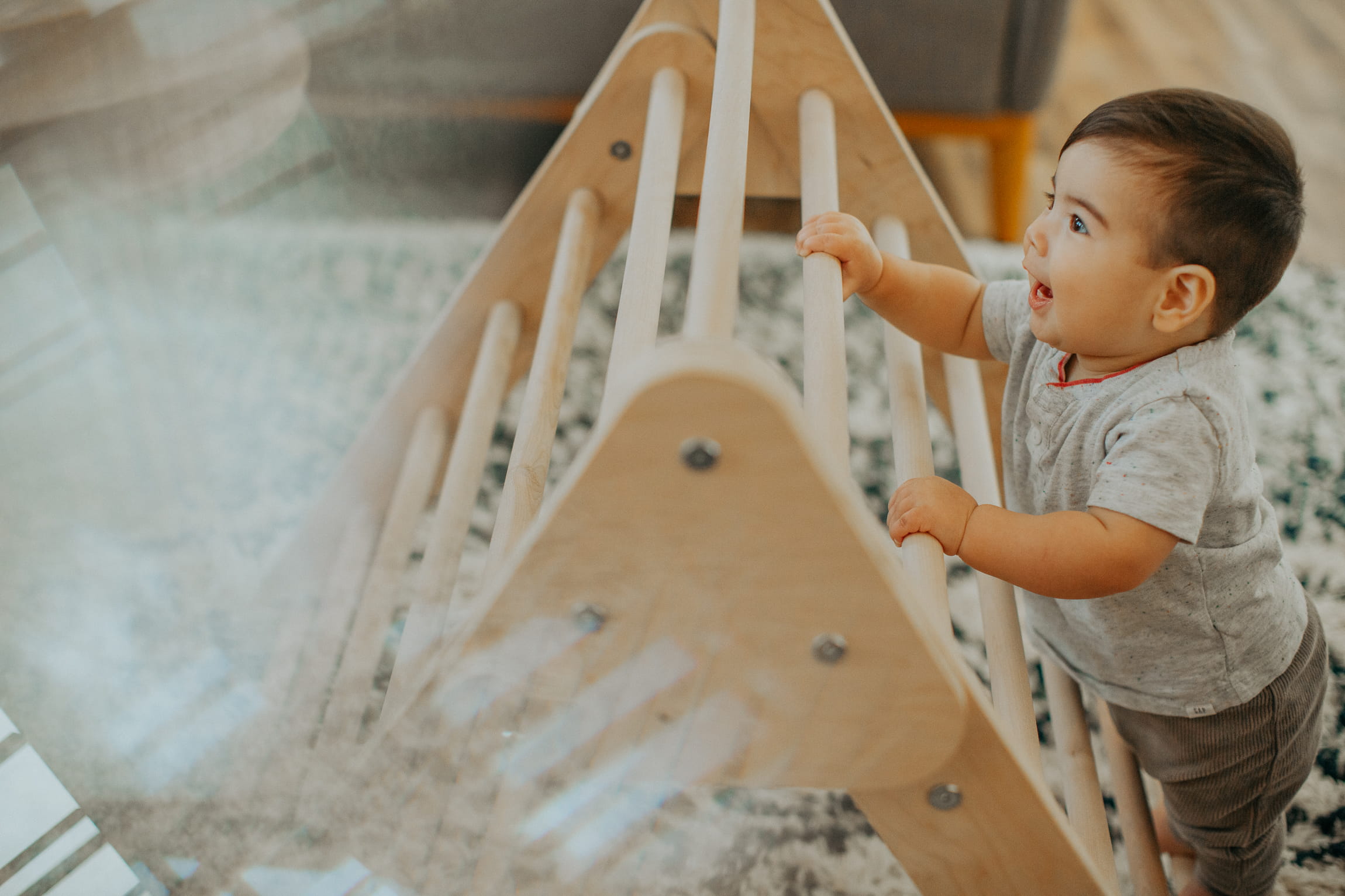 A child playing on a children's ladder