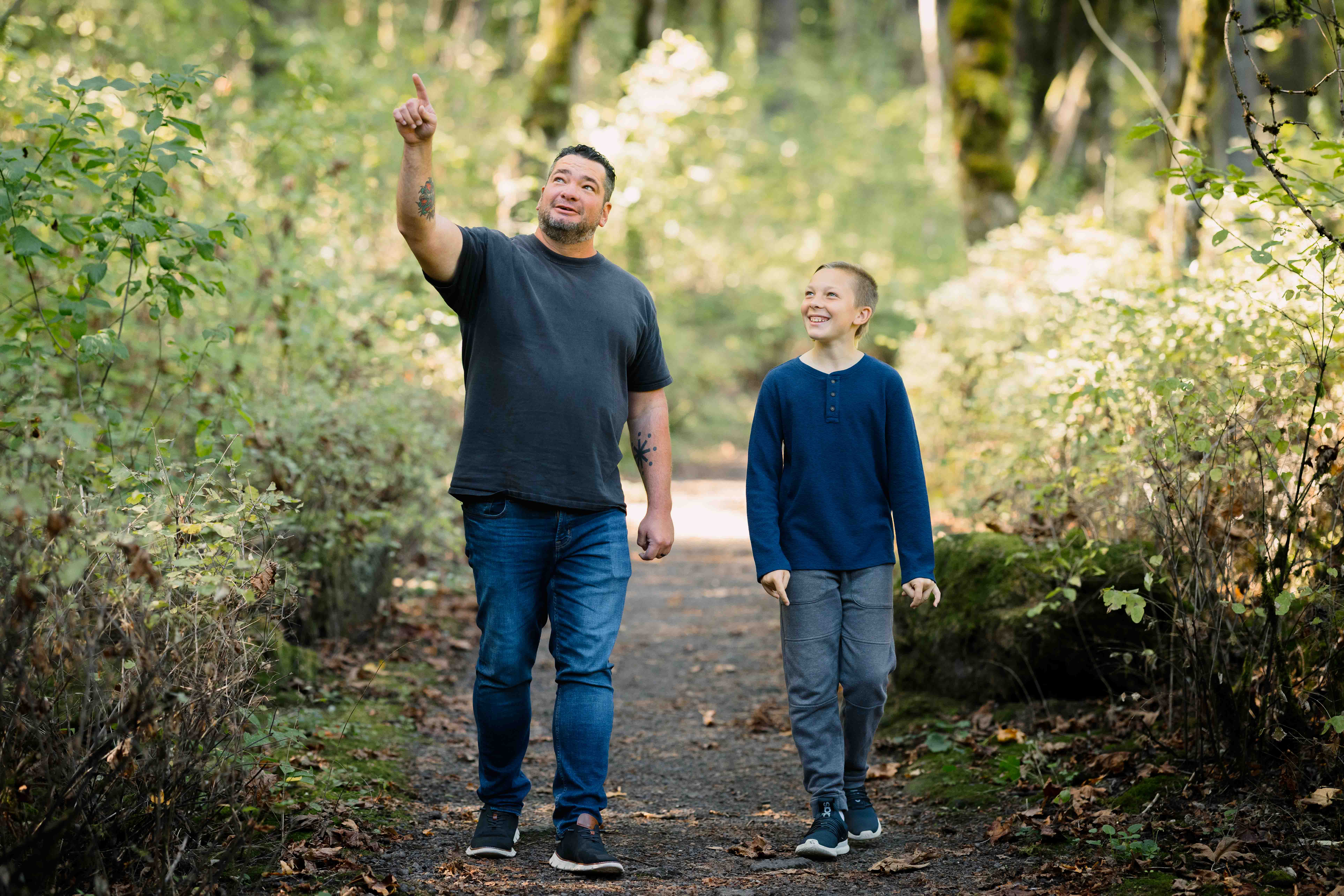 Father and son on a walk in the woods