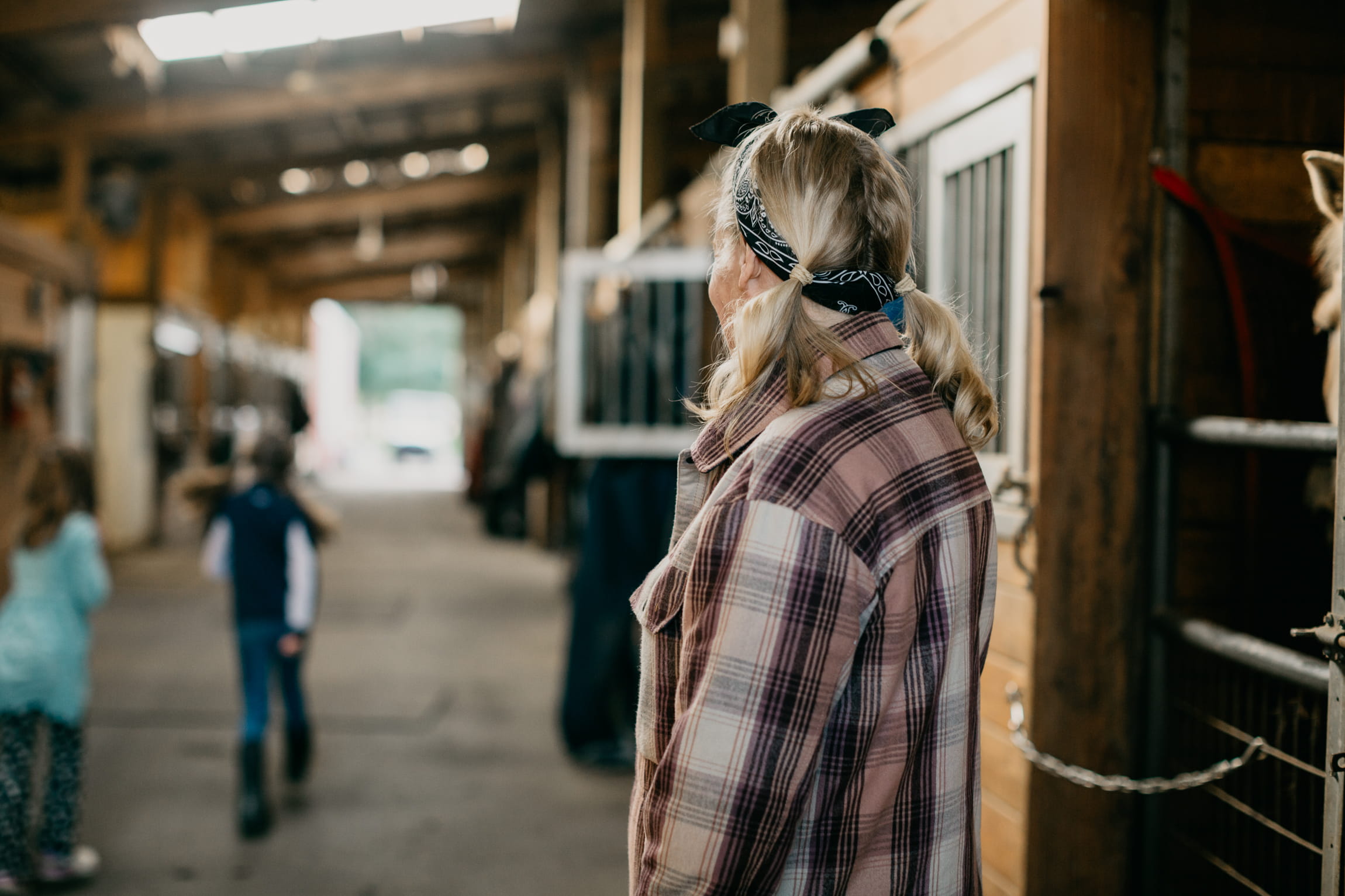 Mother in barn with her children